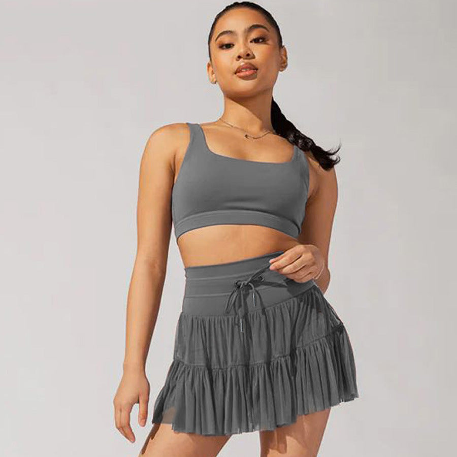Minifalda mujer cintura alta con pliegues y short integrado